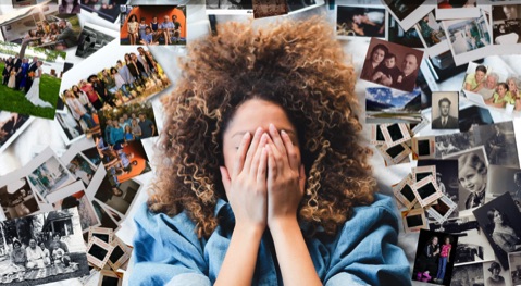 Woman surrounded by photographs